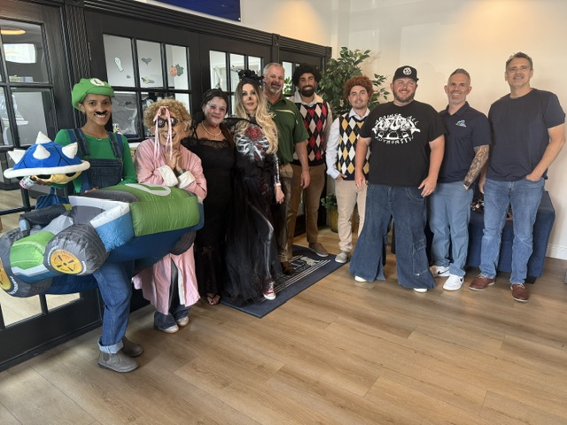 The Dueall team together in their Halloween costumes